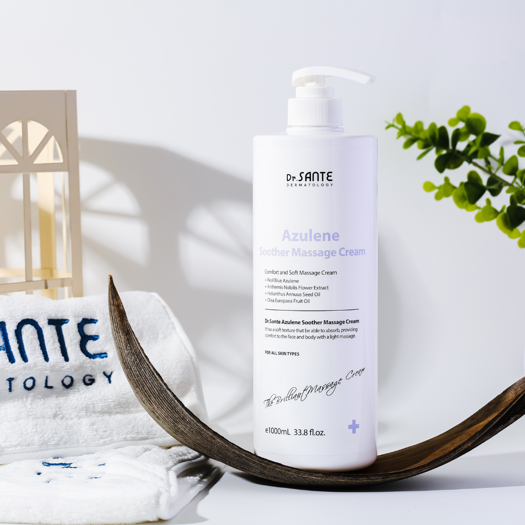 Dr.Sante Azulene Soother Massage Cream (1000ml) Large-Capacity Massage Cream for Face, Décolleté, Body & Legs A rich, nourishing cream infused with moisturizing and vegetable oils to keep skin hydrated and supple. Its non-sticky, non-greasy texture allows for long massage sessions while leaving only a soft, hydrated finish. Safe to use with heated beauty devices, thanks to its gentle and stable formula. The absorbable texture means there’s no need to wipe off after massage simply let it absorb into the skin. If excess product remains from a long massage, gently wipe away any residue. Dr.Sante Azulene Soother Massage Cream Ingredients AQUA, Helianthus Annuus (Sunflower) Seed Oil, Ethylhexyl Stearate, Caprylic/Capric Glycerides, Glycerine, Butylene Glycol, Olea Europaea (Olive) Fruit Oil, 1,2-Hexanediol, Cetyl Alcohol, Glyceryl Stearate, Sorbitan Sesquioleate, Polysorbate 60, Stearic Acid, Butyrospermum Parkii (Shea) Butter, Arginine, Carbomer, Lavandula Angustifolia (Lavender) Extract, Tocopheryl Acetate, Triticum Vulgare (Wheat) Germ Oil, Acetyl Hexapeptide-8, Camellia Sinensis Leaf Extract, Rosa Centifolia Flower Water, Centella Asiatica Extract, Anthemis Nobilis Flower Extract, Hamamelis Virginiana Extract, Aloe Vera Leaf Extract, Guaiazulene, Fragrance, Disodium EDTA Dr. SANTE – KOREA NO.1 AESTHETIC BRAND Loved by Korean estheticians and K-beauty customers Beautiful skin starts from here. | You’ll hear the difference in your skin – with Dr. SANTE